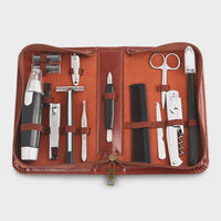 Open brown leather pouch showing multiple tools inside