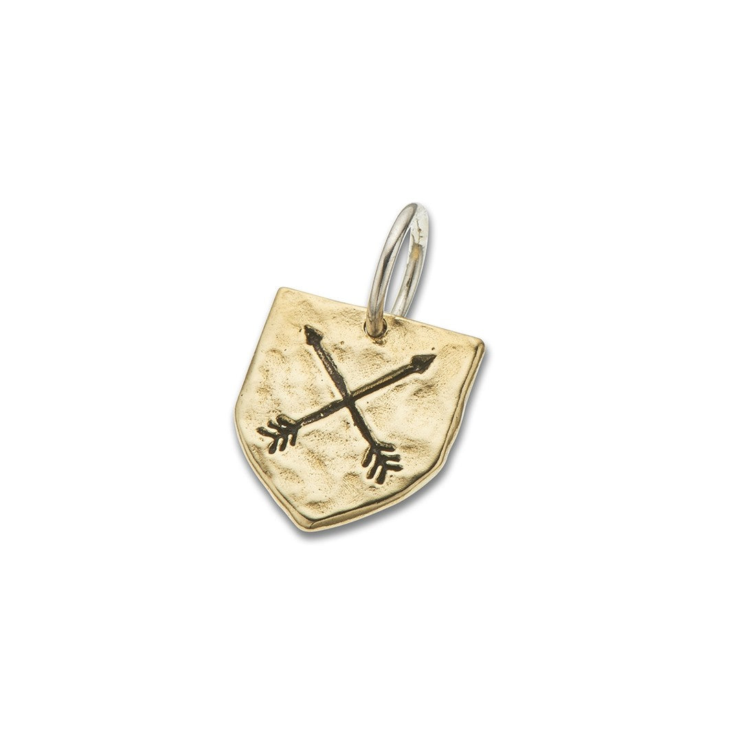 Shield shaped brass charm with crossed arrows