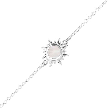 Silver chain bracelet with sun charm with round mother of pearl inlay in the center