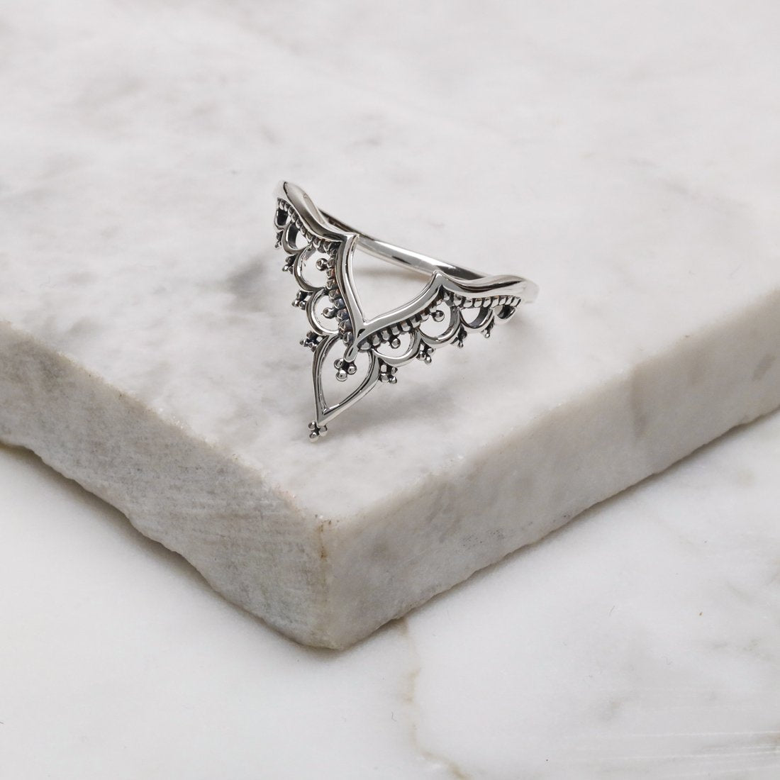 Silver ring with filigree V shape
